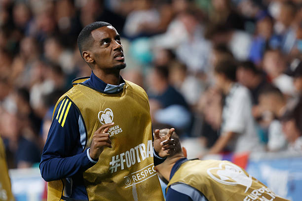 Alexander Isak warms up on the sidelines for Sweden.