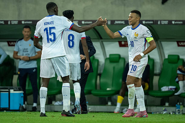 Kylian Mbappe and Ibrahima Konate celebrate.